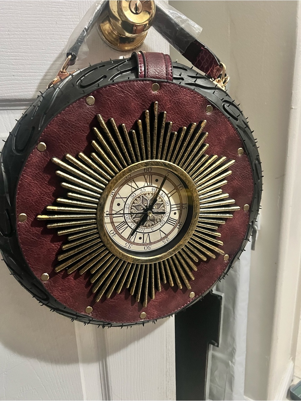 Round Burgundy Sunburst Clock-Accent Crossbody Bag